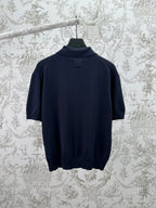 Navy knit polo shirt with ribbed collar and straight hem