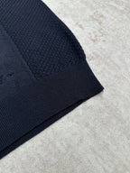 Navy knit polo sleeve hem with ribbed cuff and textured knit