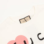 White Gucci graphic T-shirt neckline with Gucci label