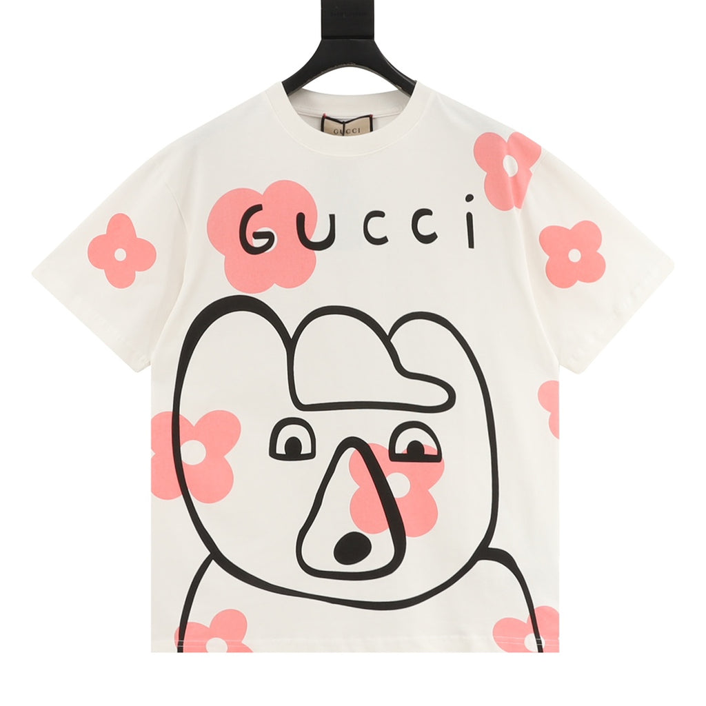 White Gucci graphic T-shirt with black outline animal and pink flower accents
