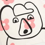 White Gucci graphic T-shirt close-up of black-and-pink animal face design