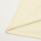 Cream T-shirt hem and side stitching detail