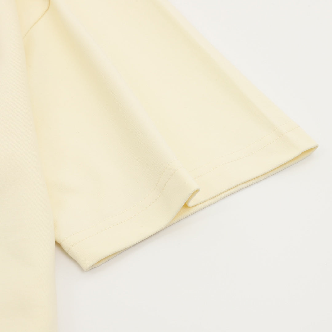 Cream short-sleeve T-shirt with folded sleeve and hem detail