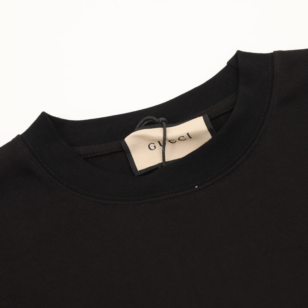 Black crew-neck T-shirt with embroidered tag at collar