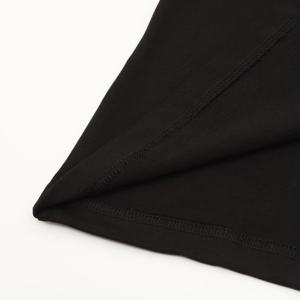 Black T-shirt sleeve hem with visible stitching