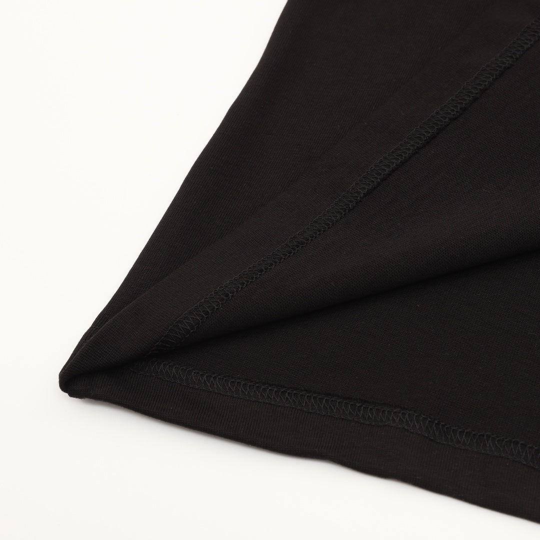 Black T-shirt sleeve hem with visible stitching