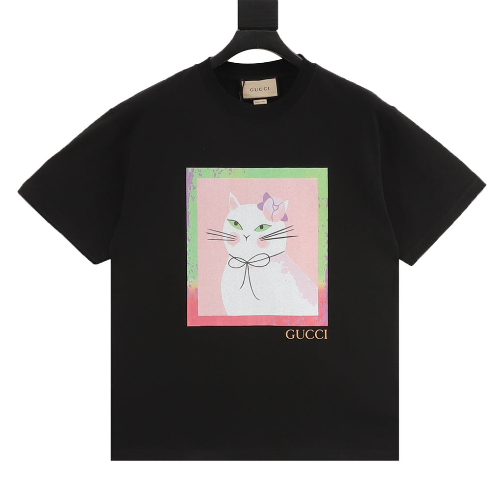 Black T-shirt with colorful cat face graphic on front and Gucci logo near hem