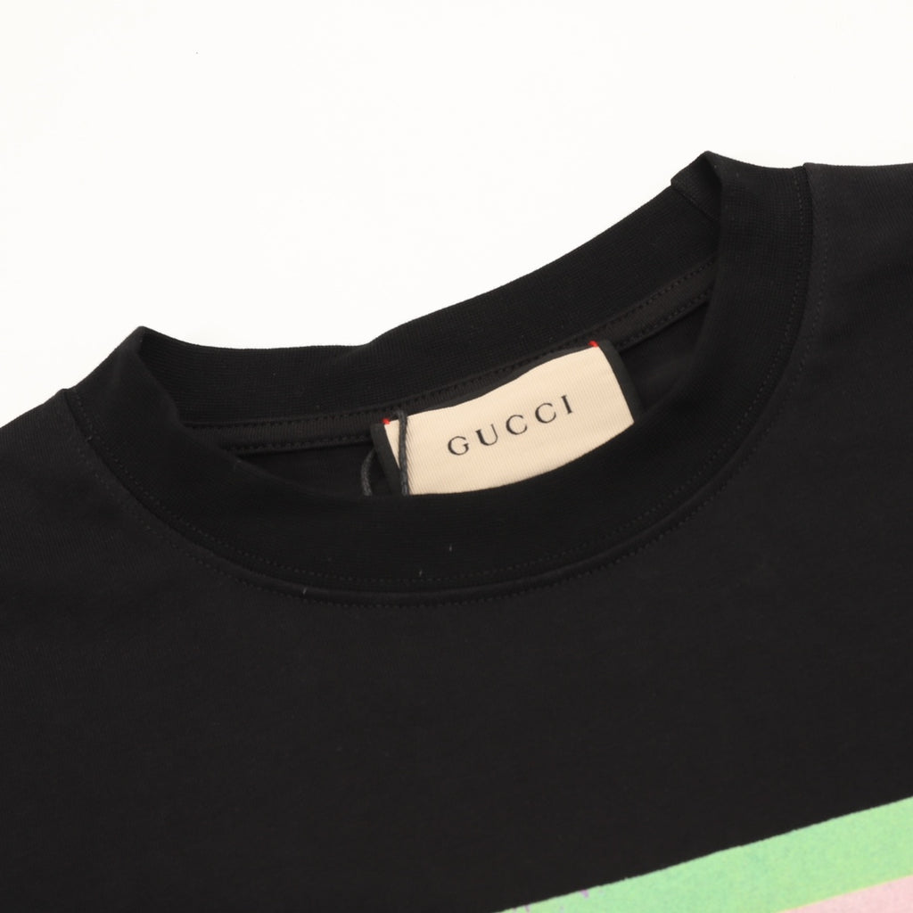 Black T-shirt neckline with Gucci brand label inside collar