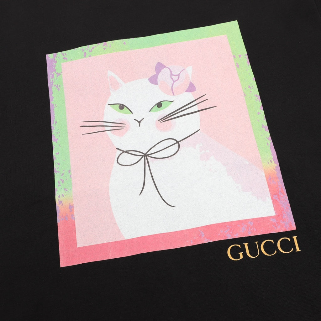 Black T-shirt front with large watercolor-style cat graphic and Gucci logo