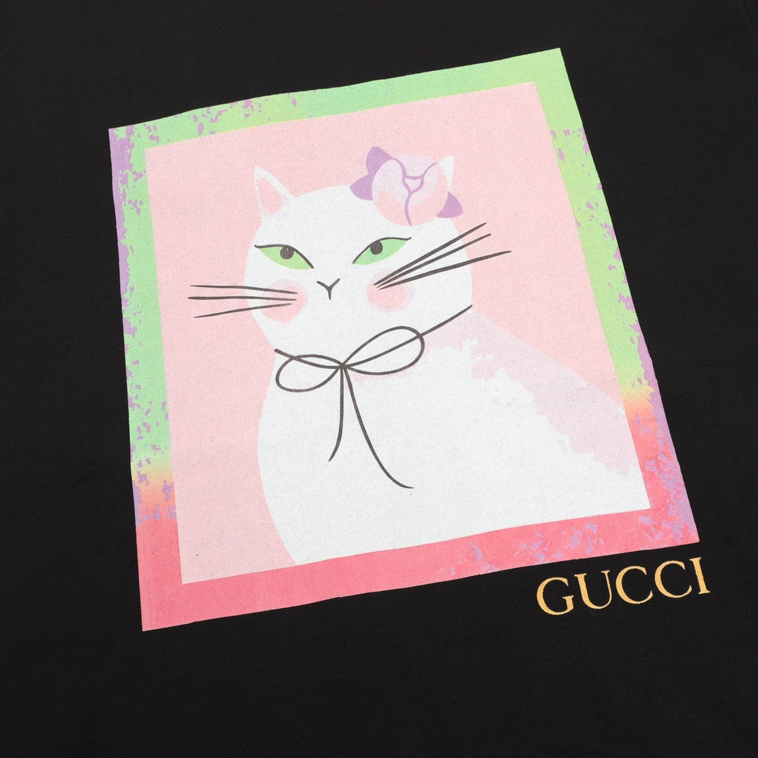 Black T-shirt front with large watercolor-style cat graphic and Gucci logo