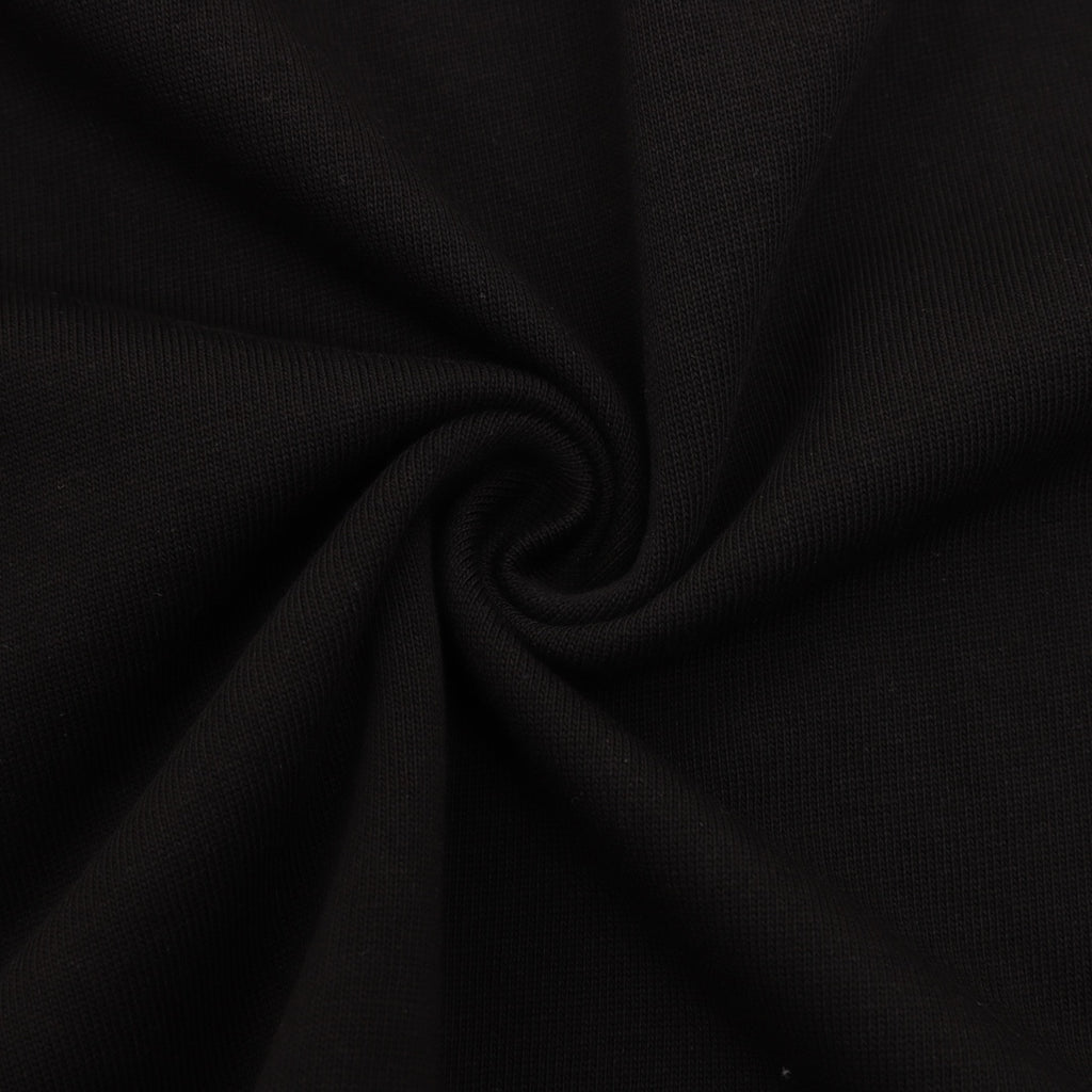 Black T-shirt fabric closeup with fine knit texture