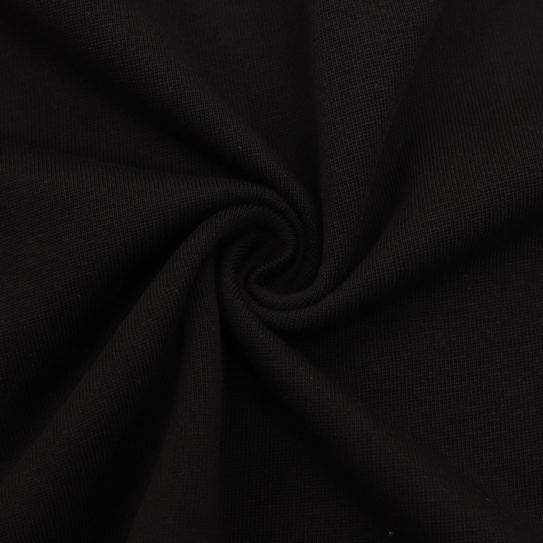 Black T-shirt fabric closeup with fine knit texture