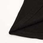 Black T-shirt hem with visible double-stitch seam