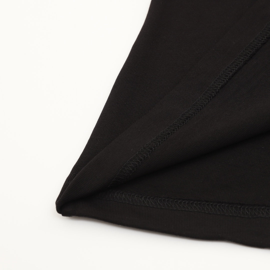 Black T-shirt hem with visible double-stitch seam