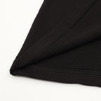Black T-shirt corner with stitched seam and overlock detail