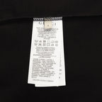 Black T-shirt with white care label and fabric composition details