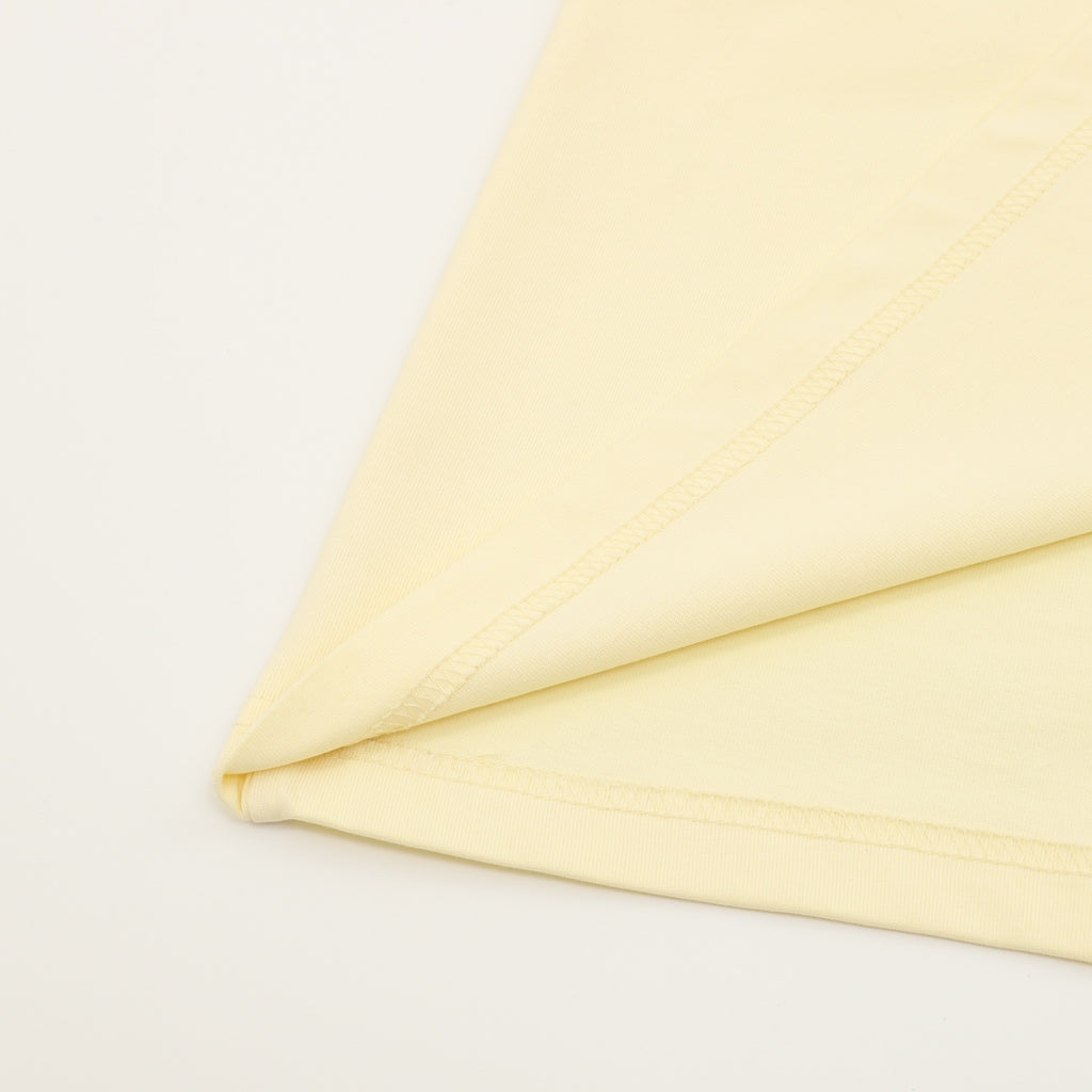Kids pale yellow T-shirt fabric and stitched seam detail