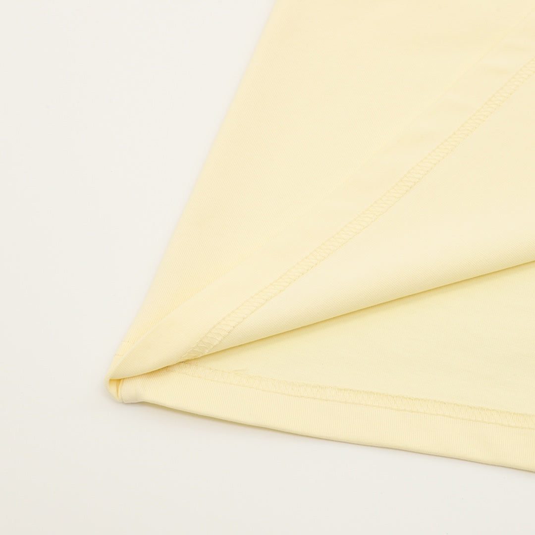 Kids pale yellow T-shirt fabric and stitched seam detail
