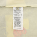 Kids T-shirt care label with barcode and fabric information