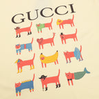 Kids pale yellow T-shirt close-up: Gucci wordmark and multicolor dog artwork