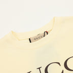 Kids pale yellow T-shirt neckline with Gucci label inside collar