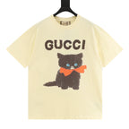 Gucci short-sleeve T-shirt in pale yellow with “GUCCI” and a black cat graphic