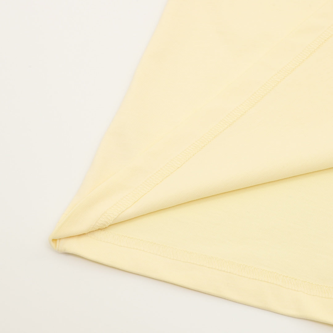 Gucci short-sleeve T-shirt hem and stitching detail in pale yellow