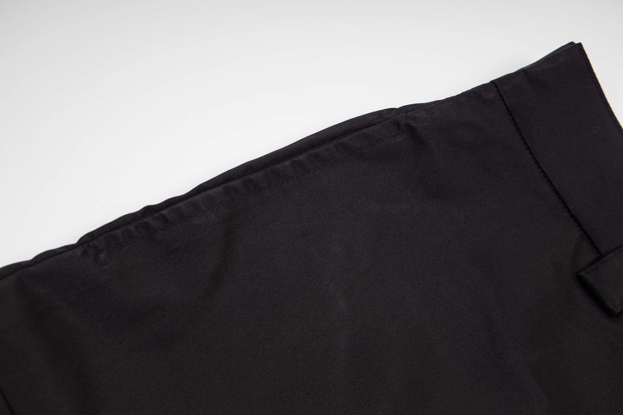Prada black shorts fabric with clean hem and seam