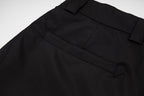 Black Prada dress pants close-up of waistband and side pocket seam