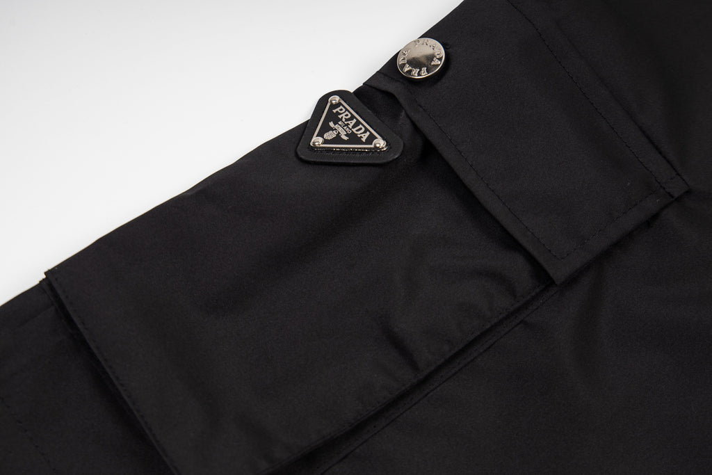 Prada black shorts with leather logo patch near waistband