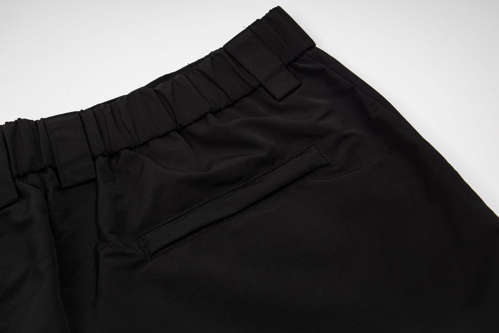 Black pants waistband with belt loops and stitched front seam