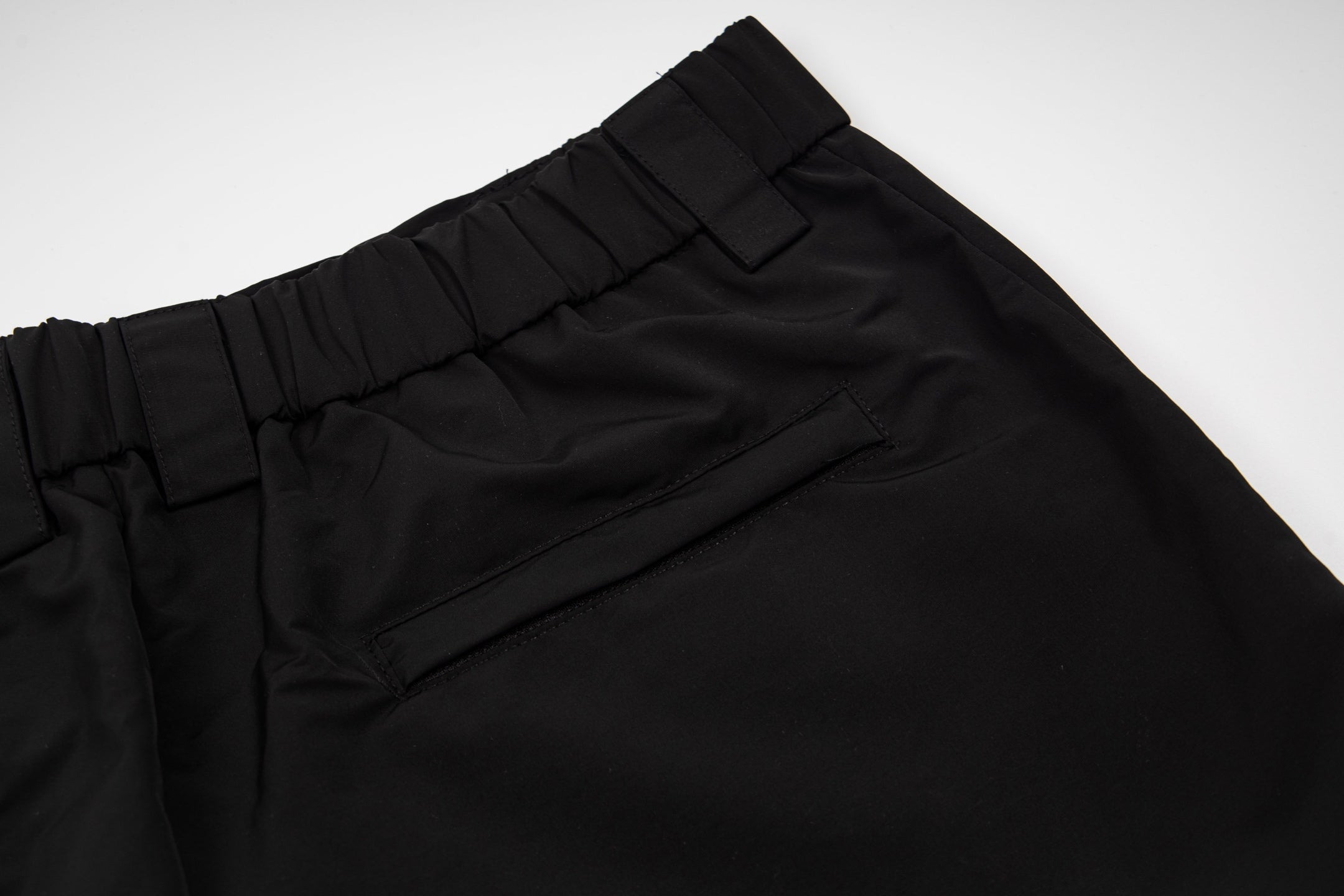 Black pants waistband with belt loops and stitched front seam
