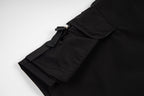 Black cargo shorts side pocket flap with strap and snap hardware