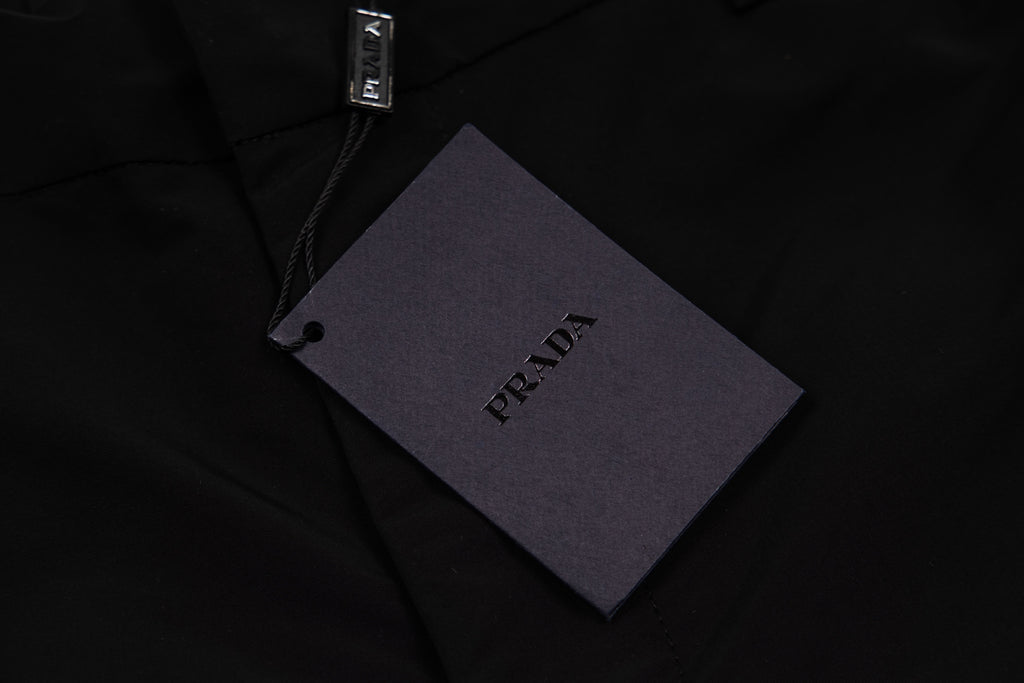 Prada black pants fabric tag on waistband area