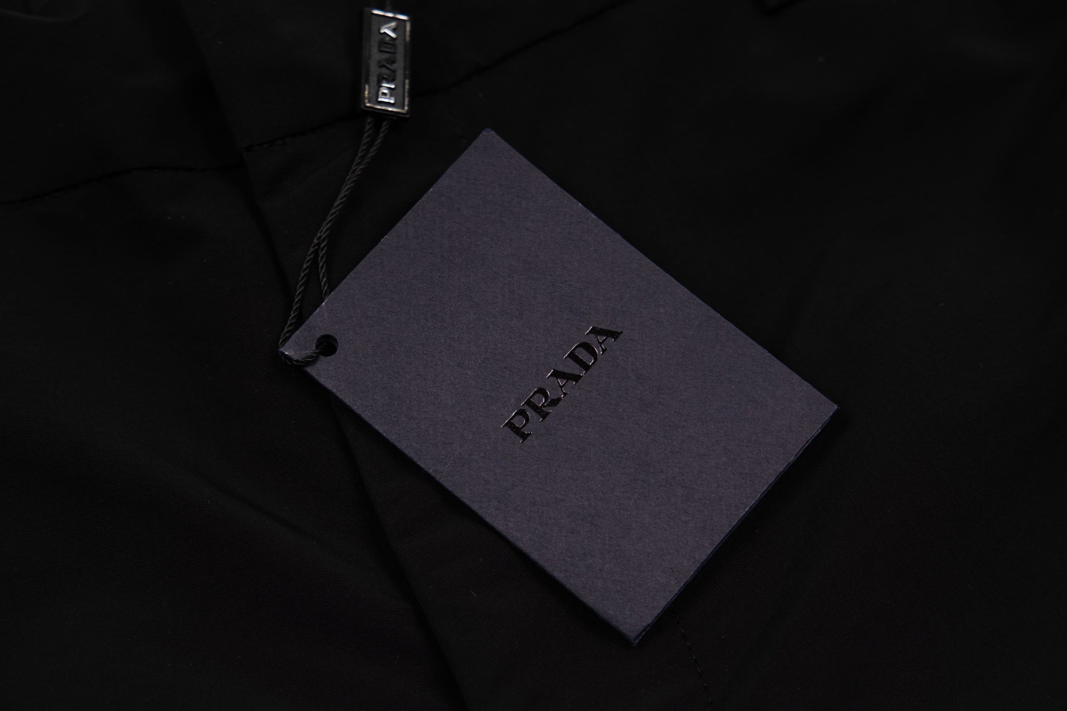 Prada black pants fabric tag on waistband area