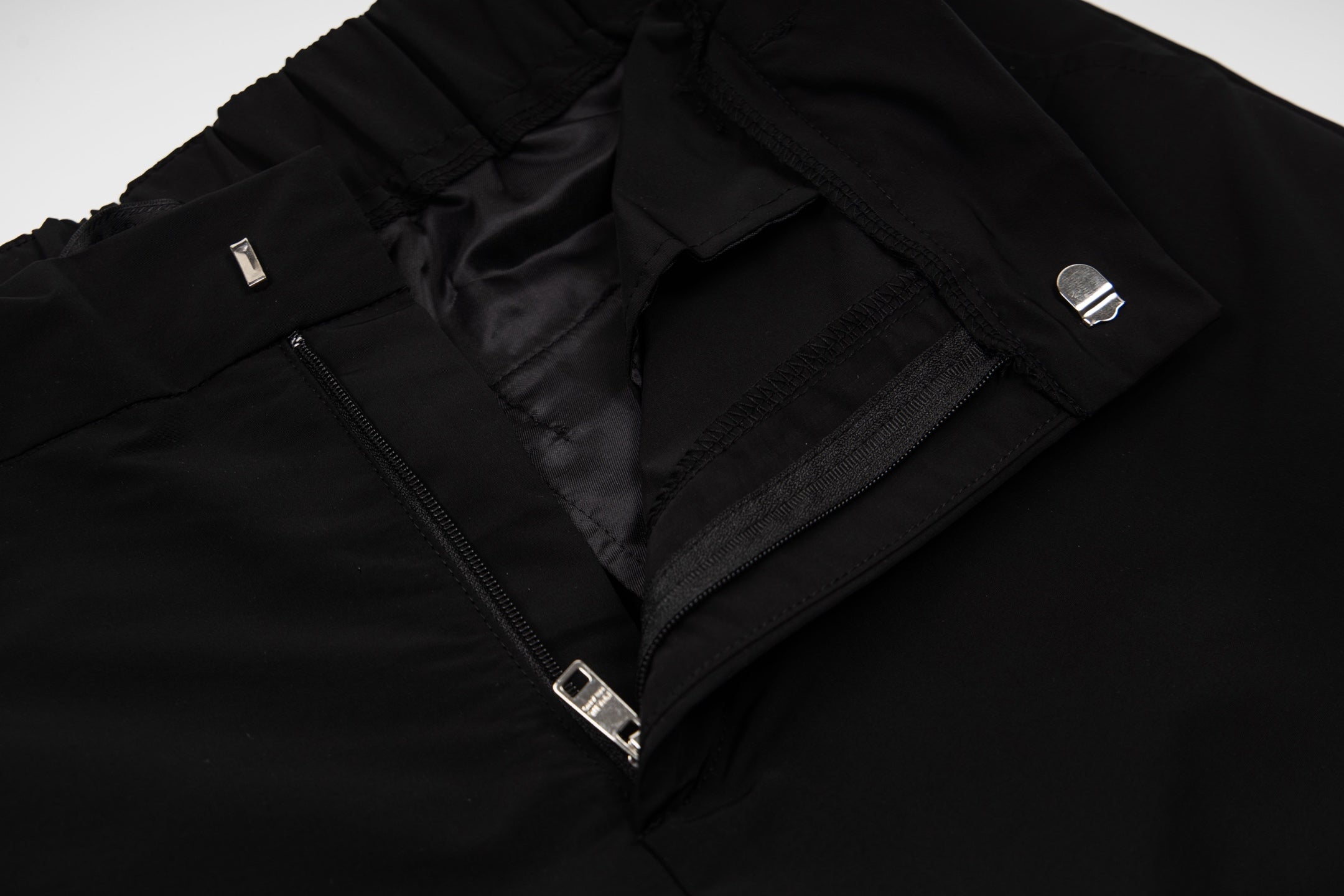 Prada black pants with zip fly, metal button, and front welt pockets