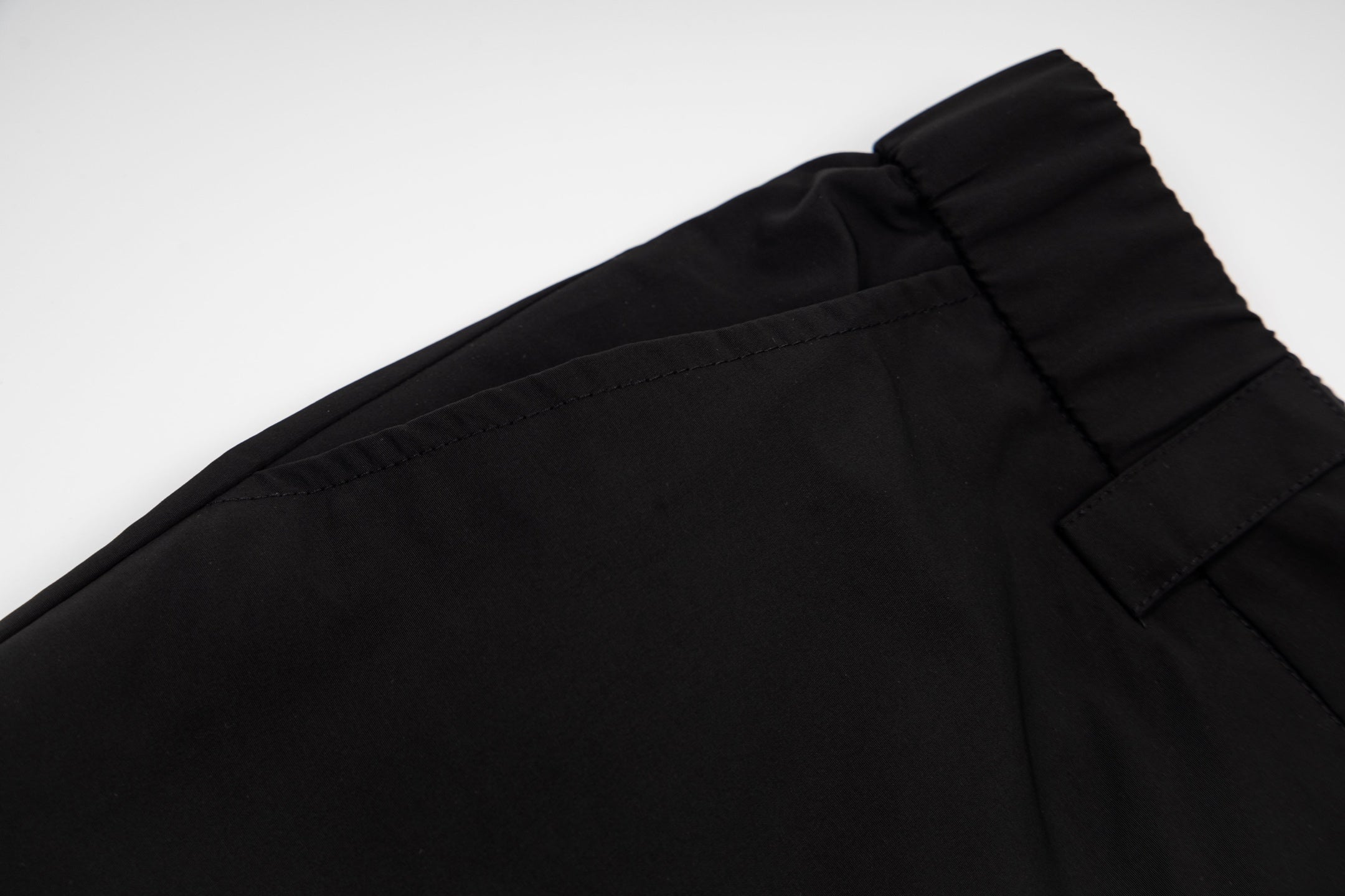 Black cargo shorts with stitched waistband and top button detail