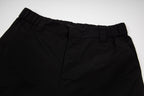 Black cargo shorts waistband with belt loops and pleated front