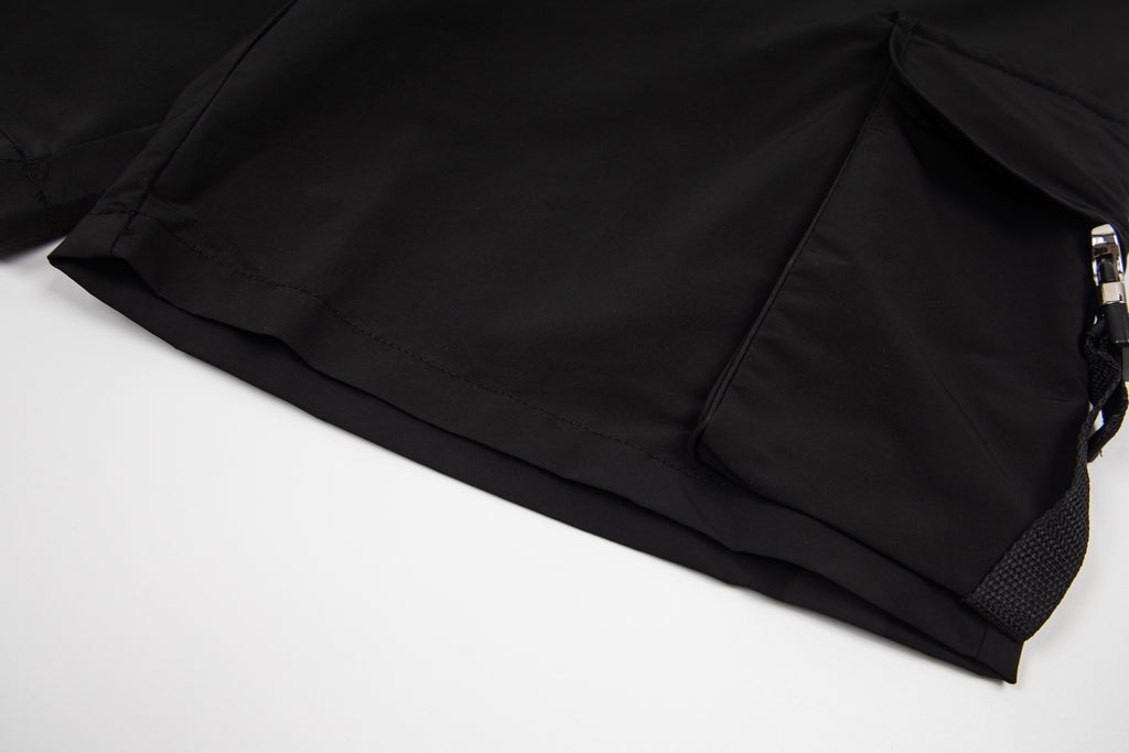 Black cargo shorts with side pocket flap and adjustable cord pull