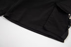 Black cargo shorts with side pocket flap and adjustable cord pull