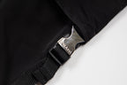 Black cargo shorts with metal logo buckle and woven strap