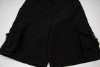 Black cargo shorts with central front seam and cargo side pockets
