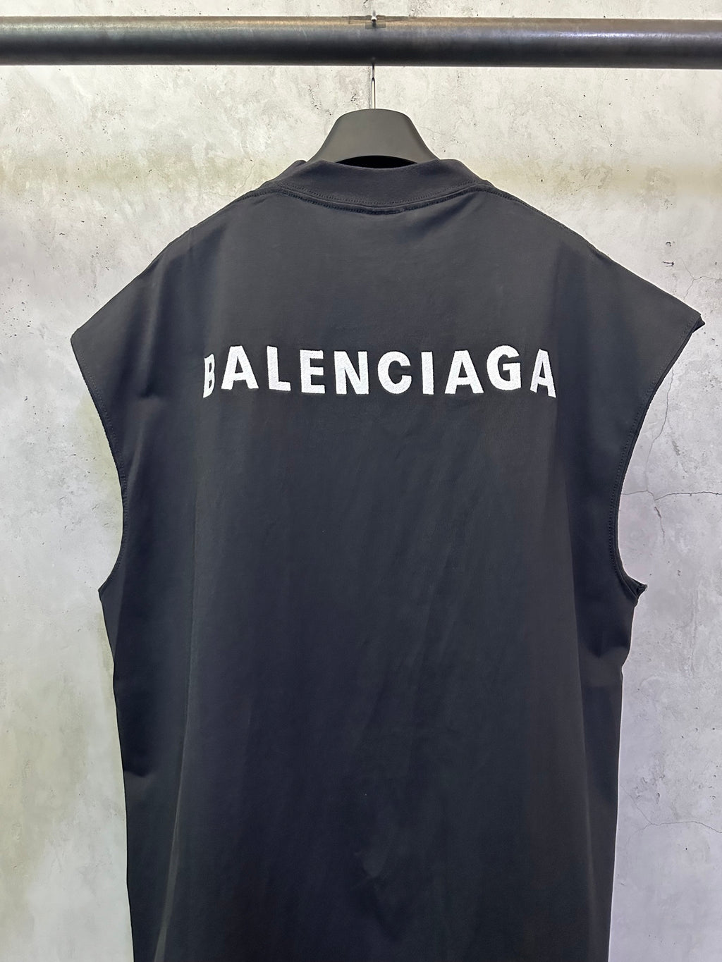 Dark sleeveless top with large BALENCIAGA back logo and crew neckline