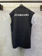 Balenciaga sleeveless top with large back logo text, dark fabric and crew neckline
