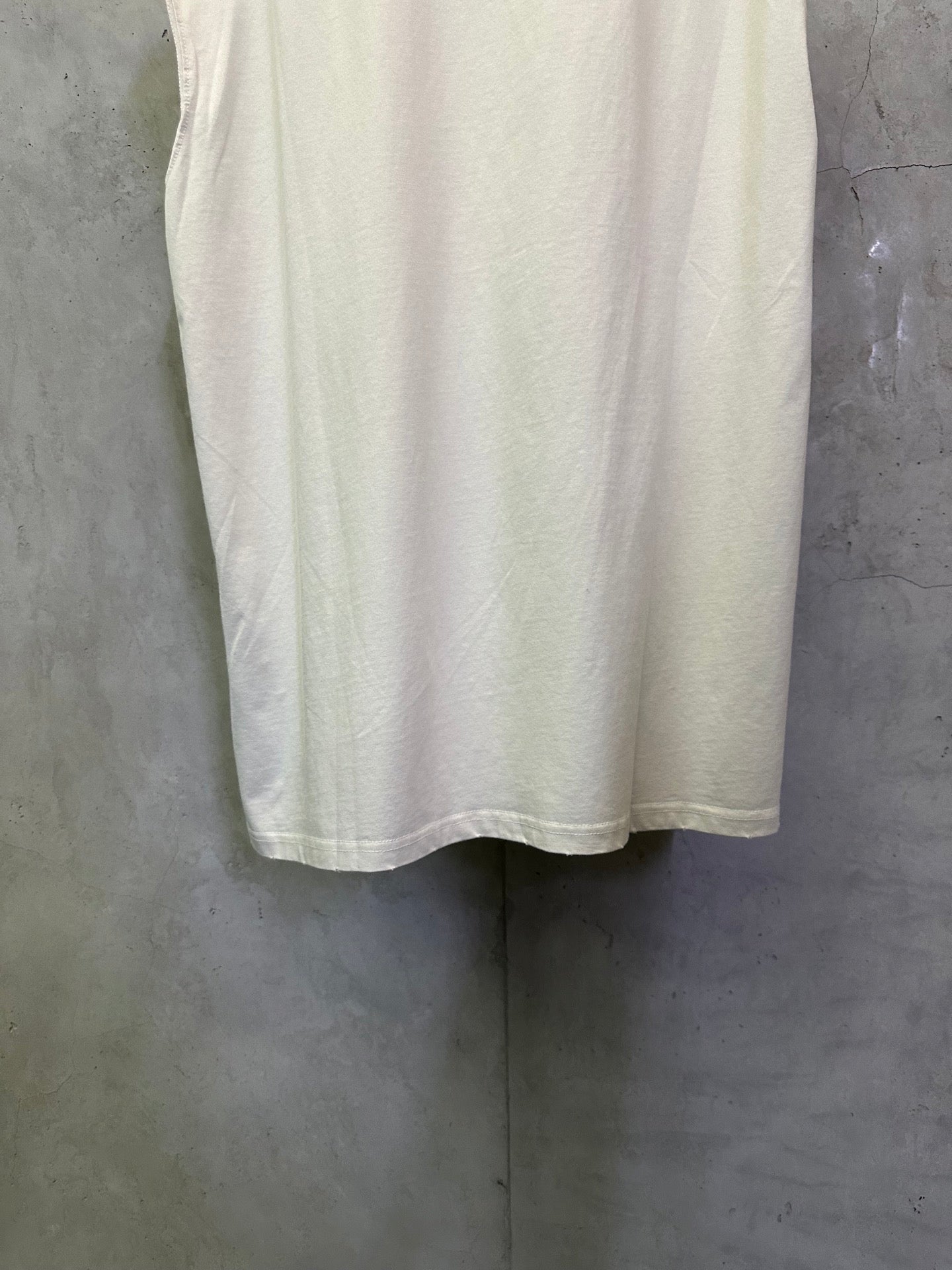White short-sleeve T-shirt back view with curved hem and sleeve openings