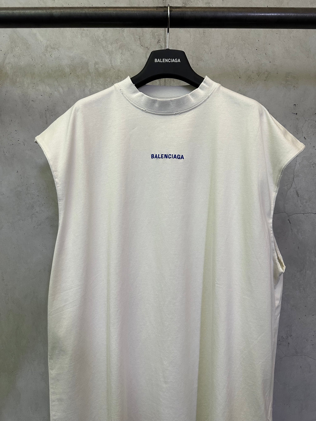 White short-sleeve T-shirt with blue BALENCIAGA logo on the front