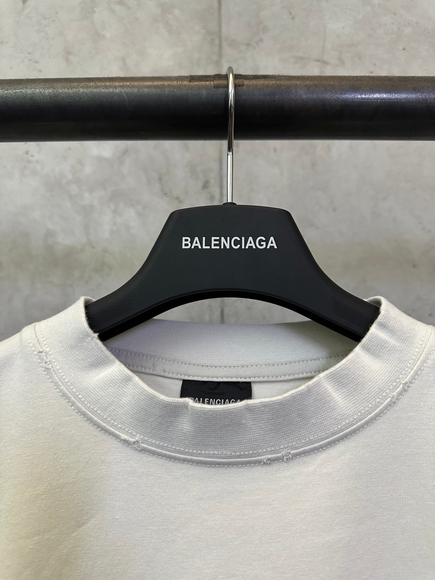 White crew-neck T-shirt with inner neck label and stitched collar