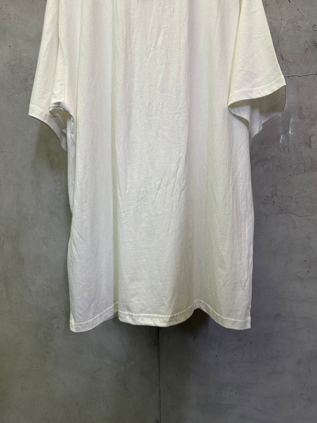 White crewneck T-shirt back view with center seam and short sleeves