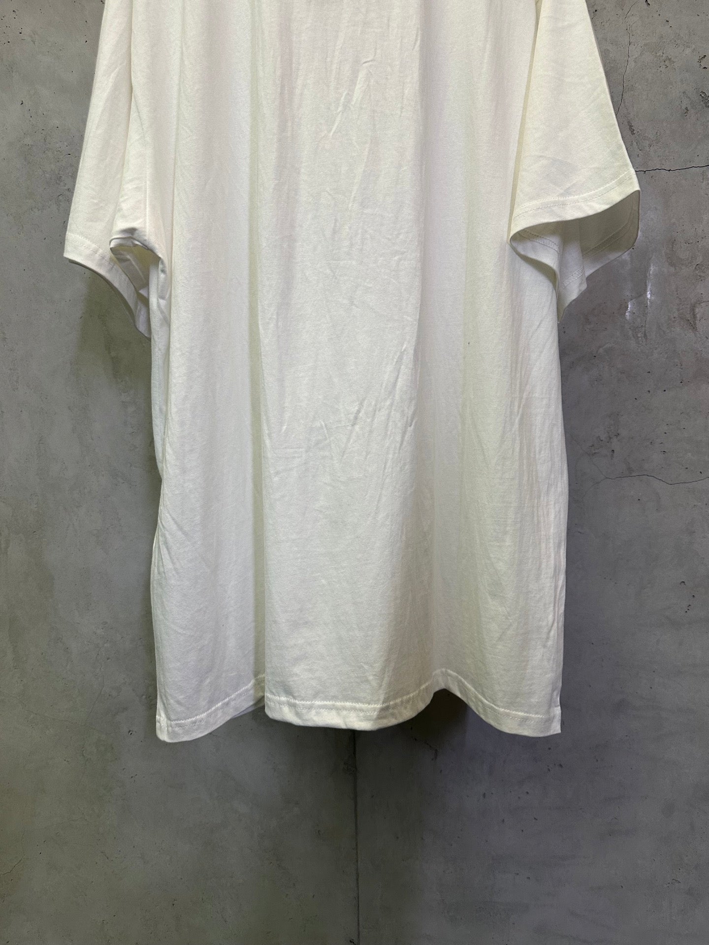 White crewneck T-shirt back view with center seam and short sleeves