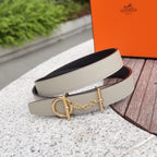 Leather belt with light strap and gold buckle, chain detail, viewed from side